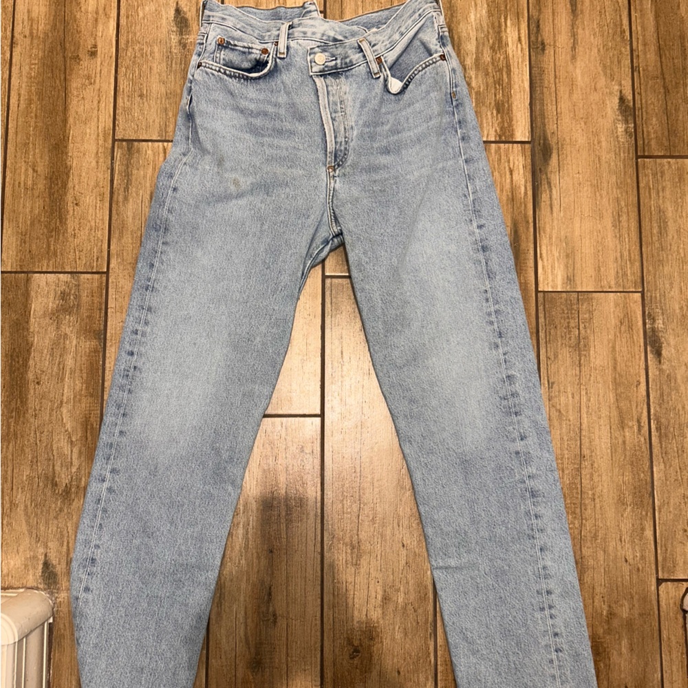 Asymmetric light wash AGOLDE jeans